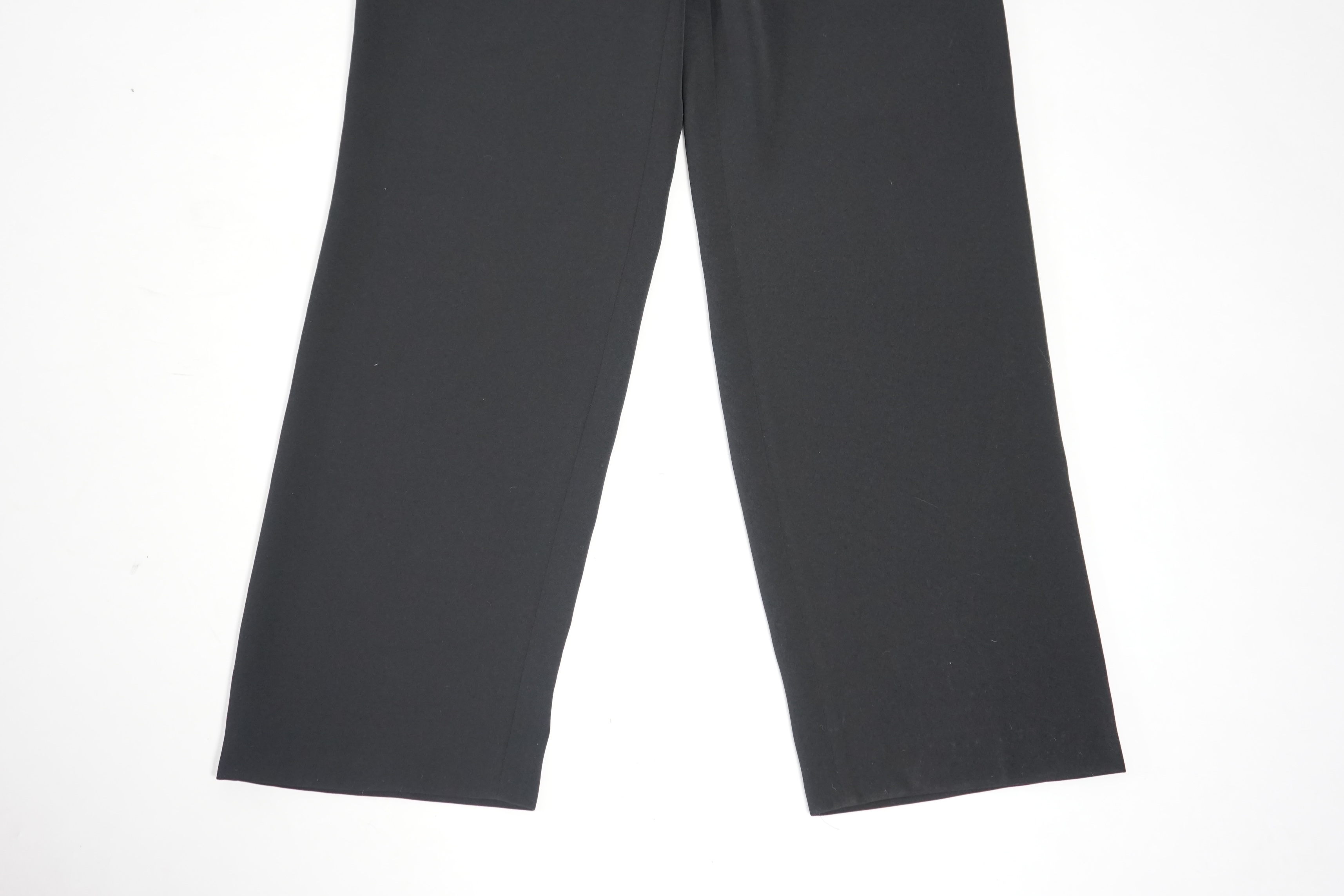 A Vera Mont black trouser suit with matching sleeveless top, extra trousers and a gold sequin Gerard Darel vest. Approx sizing 12-14 Proceeds to Happy Paws Puppy Rescue